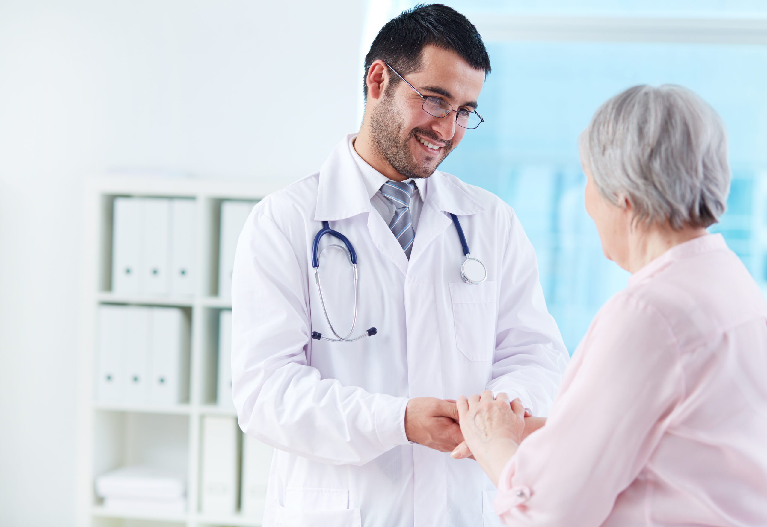 A Doctor Talking to An Elder Woman