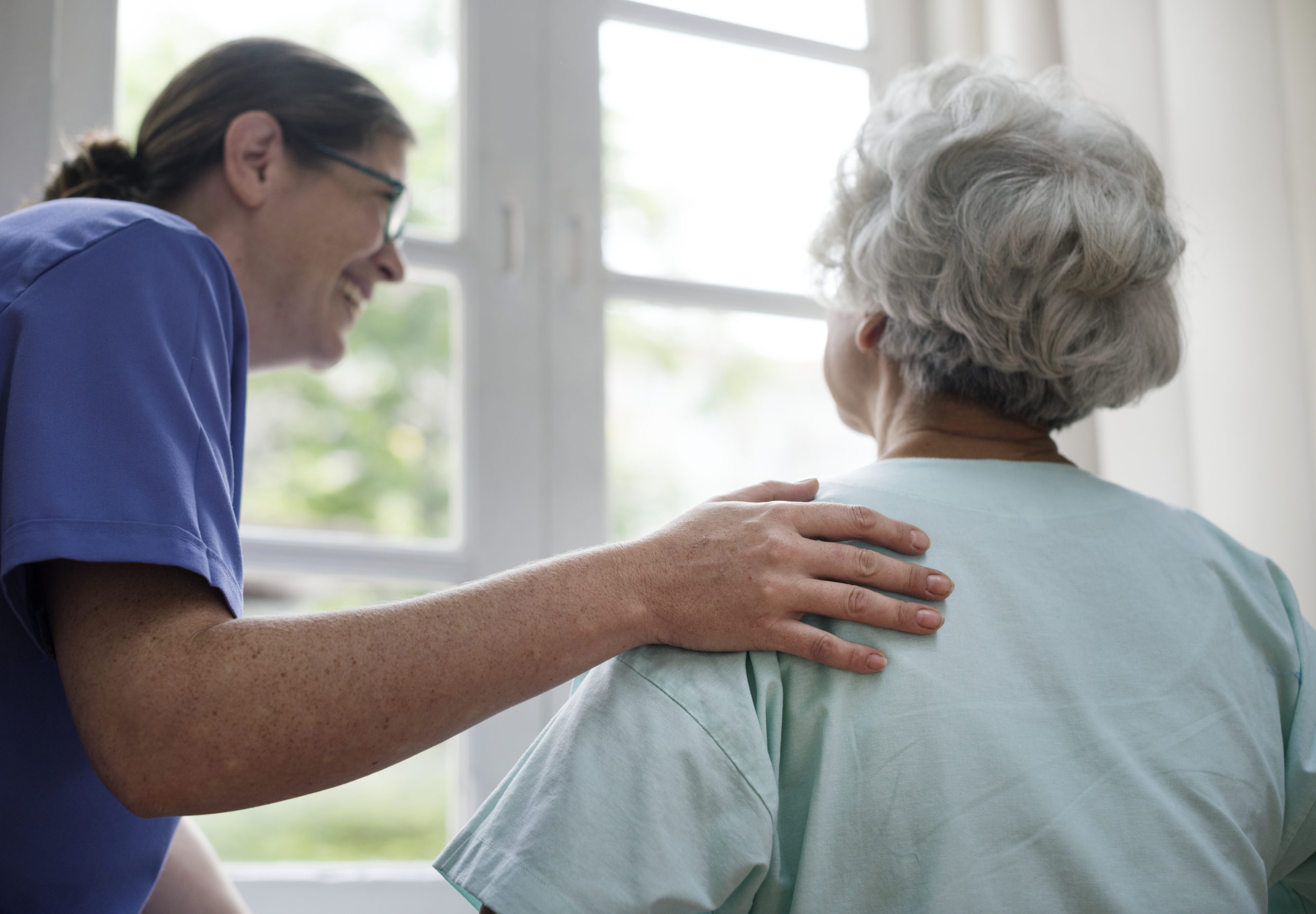 A Nurse taking Care of an Old Person