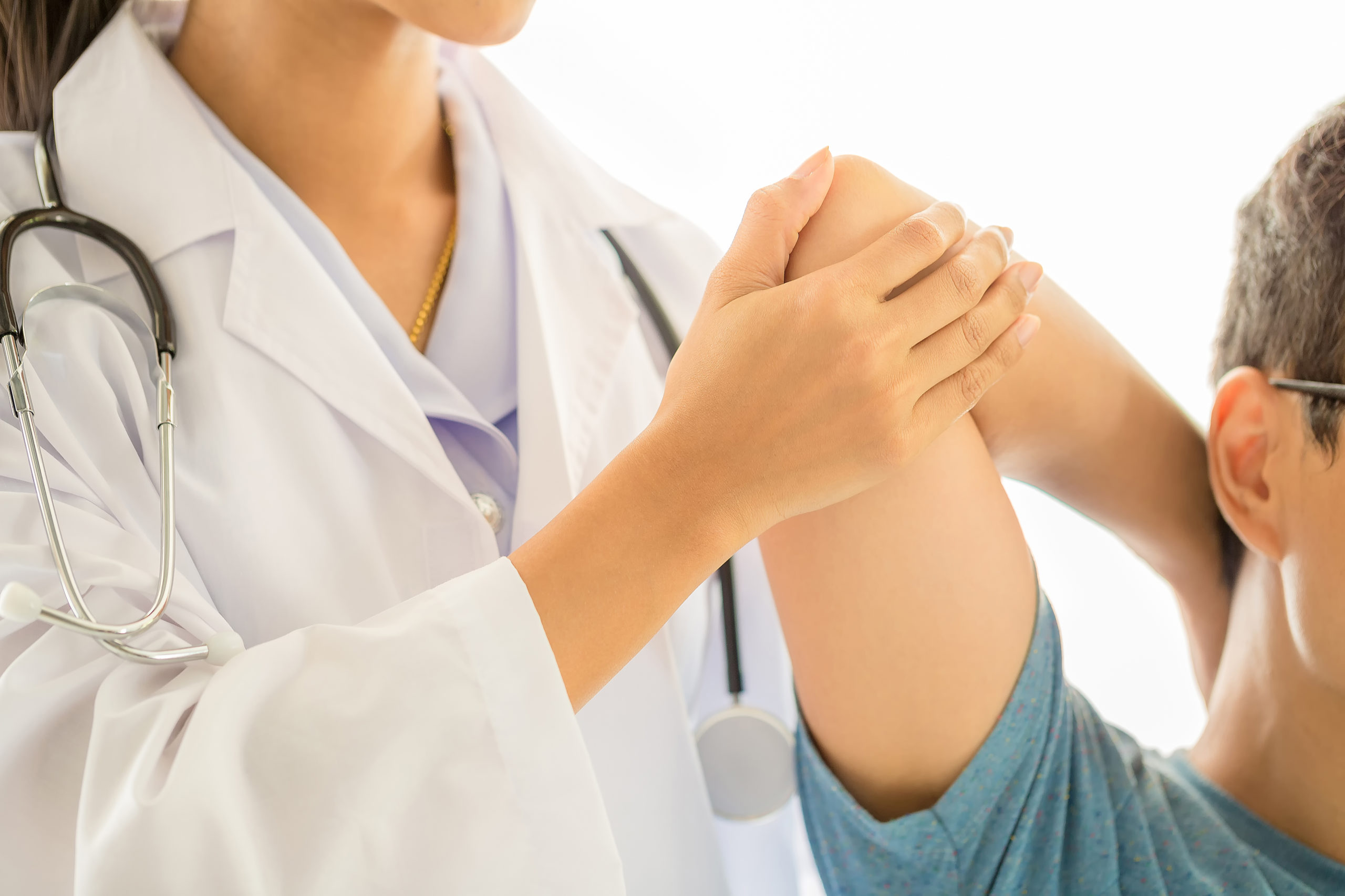 A Doctor Performing Physiotherapy on a Patient