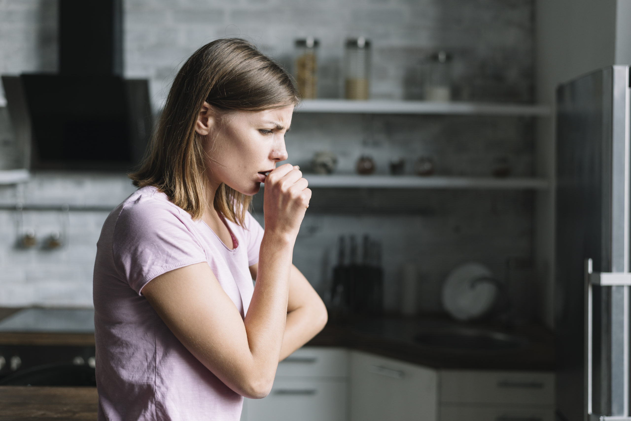 A Woman having Cough