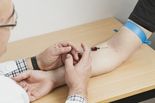 A Doctor Collecting Blood Sample