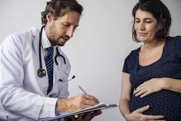 A Gynaecologist Treating a Pregnant Woman