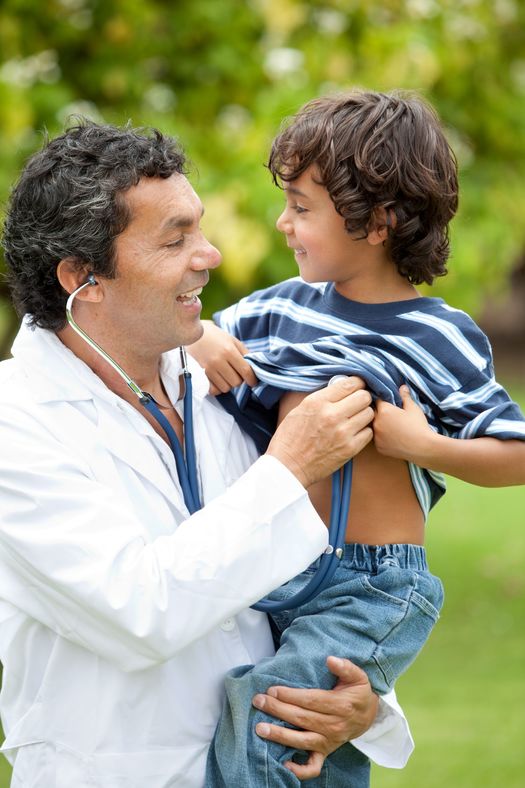 Pediatrician in JP Nagar Holding a Child